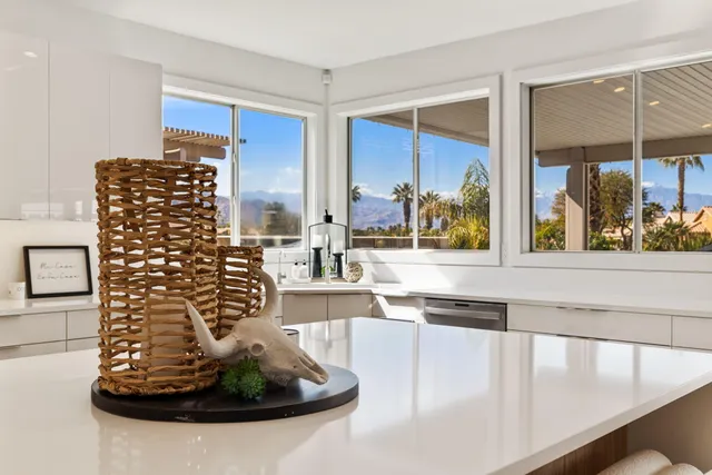 a spacious bedroom with a bed and a window