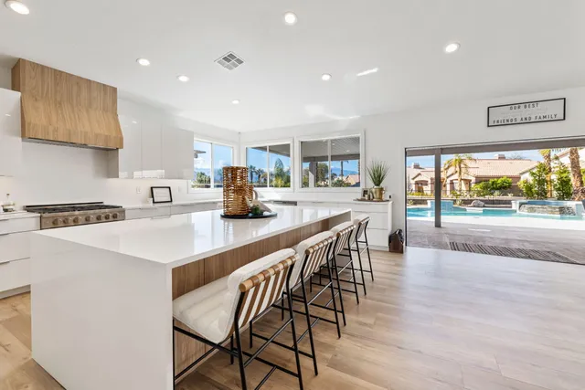a living room with fireplace furniture and a flat screen tv