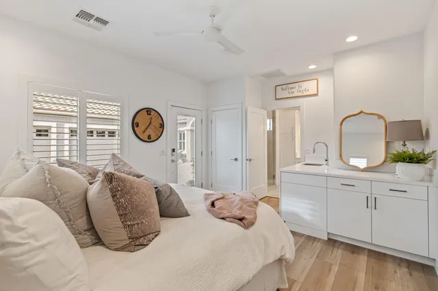 a view of a swimming pool with a table and chairs