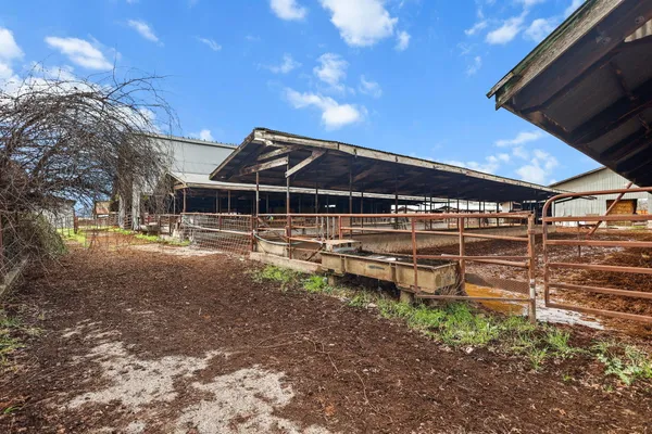 a view of a backyard with sitting area