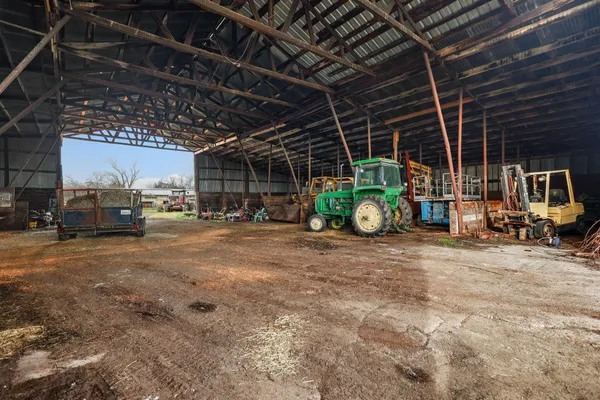 a view of garage with of a car
