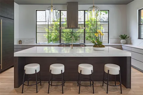 a dining table with chairs and window
