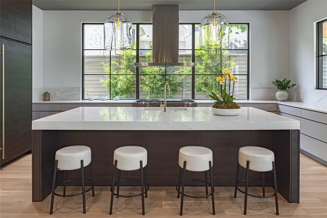a dining table with chairs and window