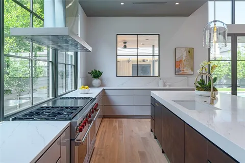 a kitchen that has a sink and a stove