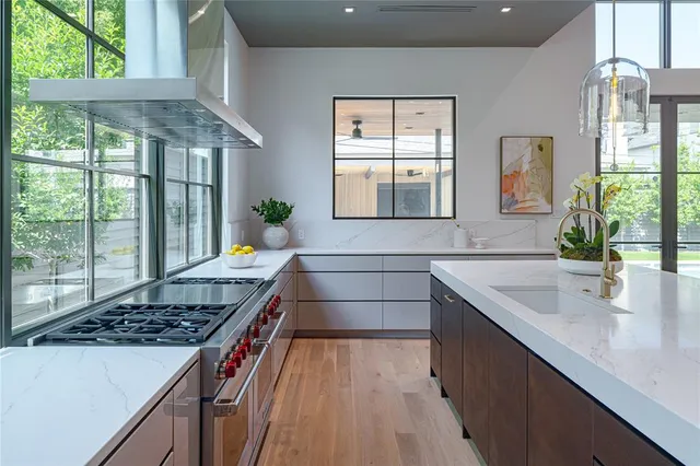 a kitchen that has a sink and a stove
