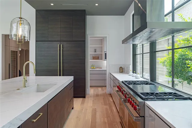 a kitchen that has a sink and a stove