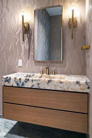 a view of bathroom with granite countertop