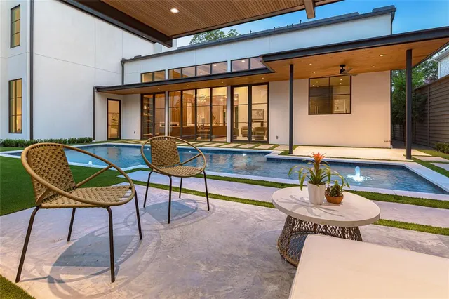 a patio with a table and chairs