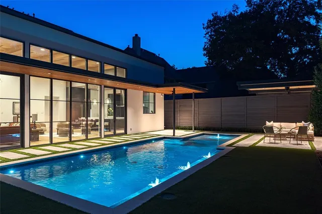 a view of swimming pool with seating area