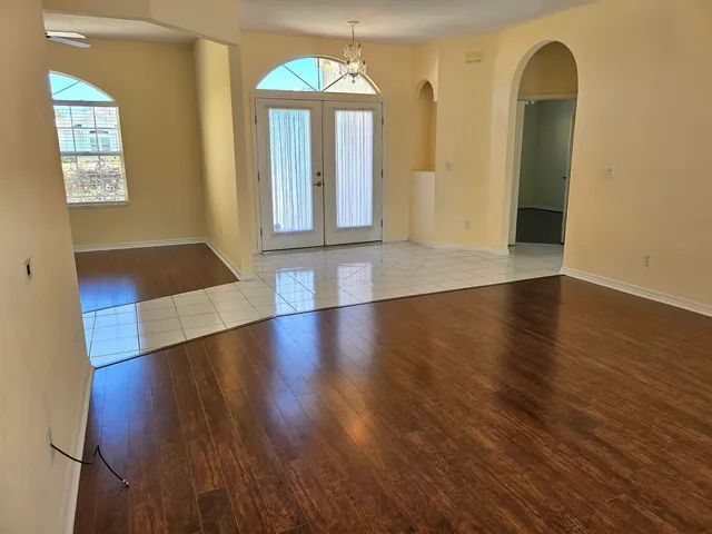 a view of an entryway with wooden floor
