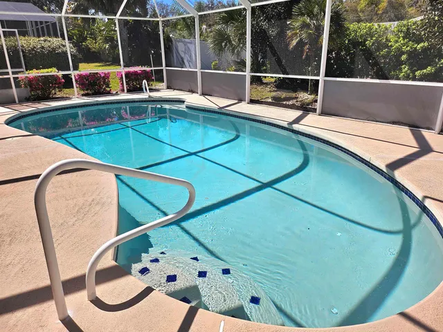 a view of swimming pool with seating area