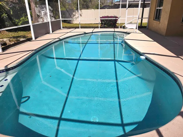 a view of a swimming pool with a balcony