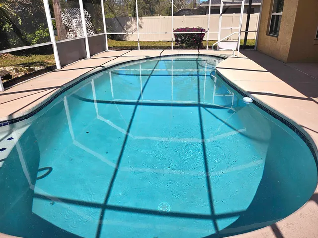 a view of a swimming pool with a balcony