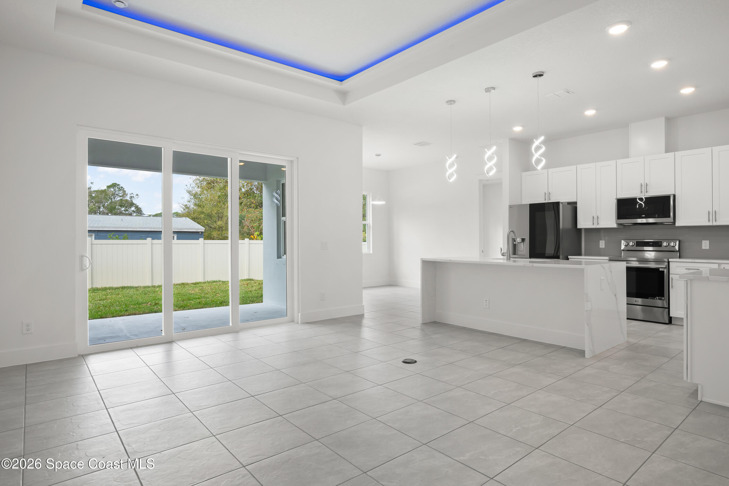 655 Vine Street Melbourne, FL 32904 - Photo 12 of 33 a view of kitchen with furniture and refrigerator