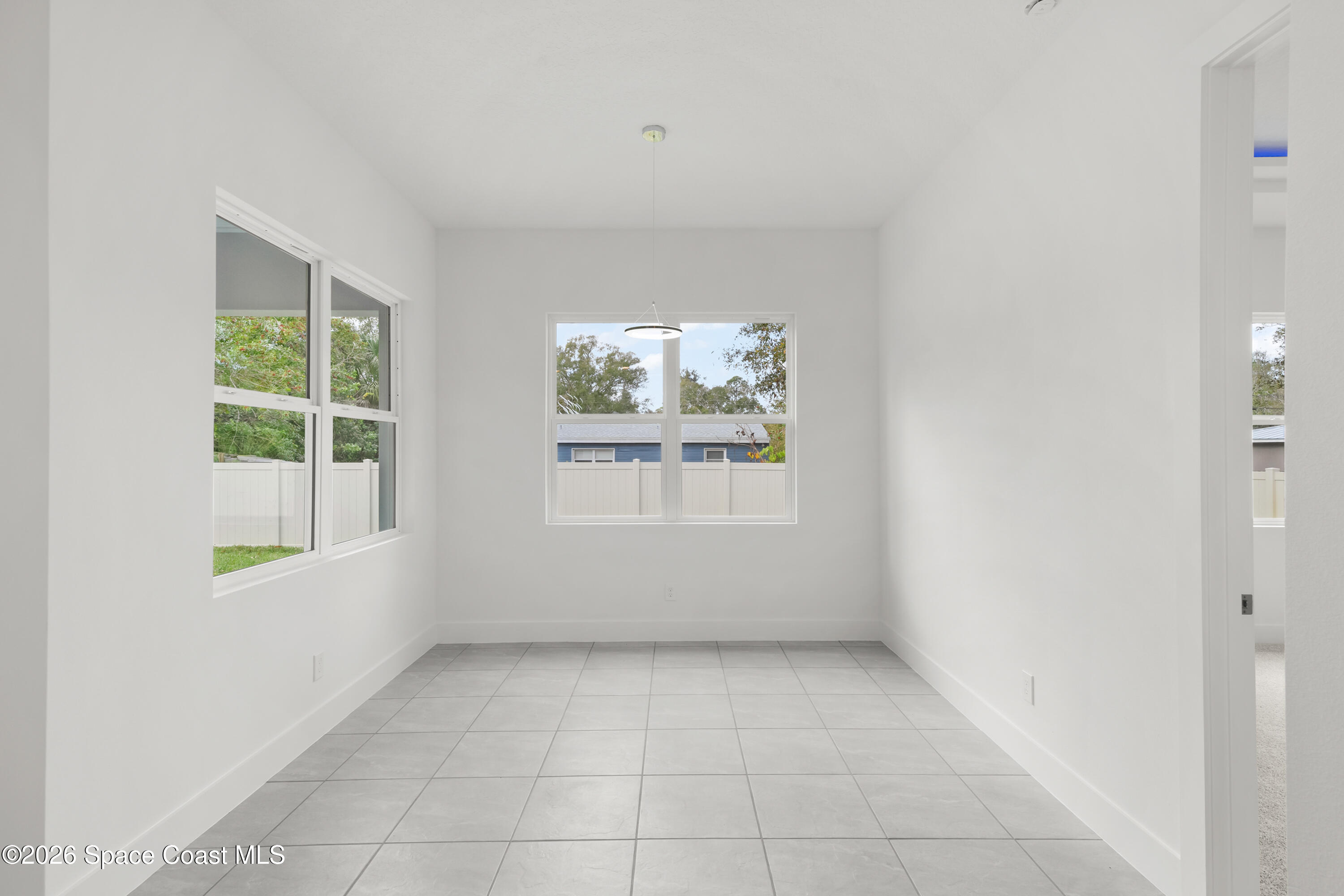 655 Vine Street Melbourne, FL 32904 - Photo 16 of 33 an empty room with windows