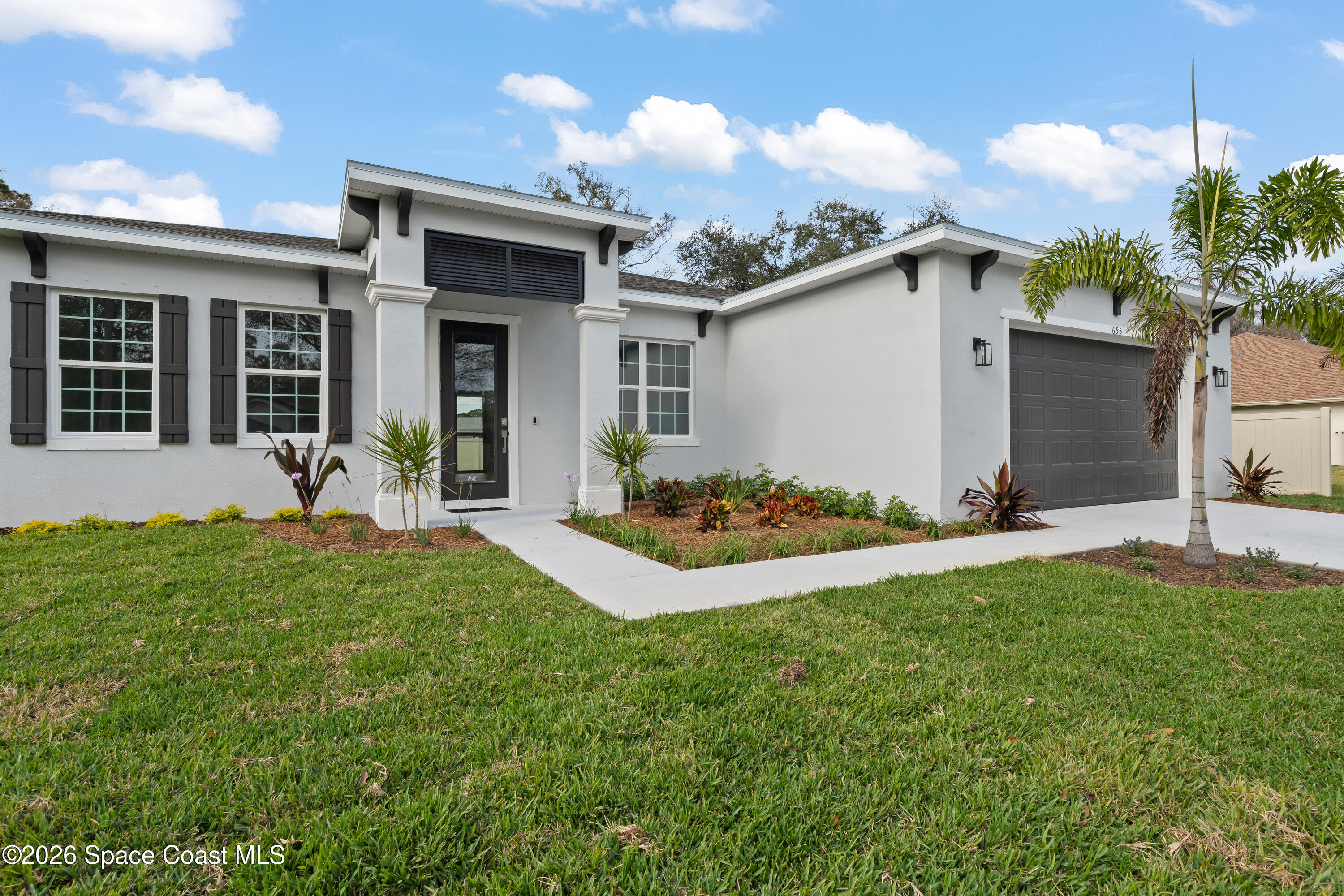 655 Vine Street Melbourne, FL 32904 - Photo 2 of 33 a view of a house with backyard and garden