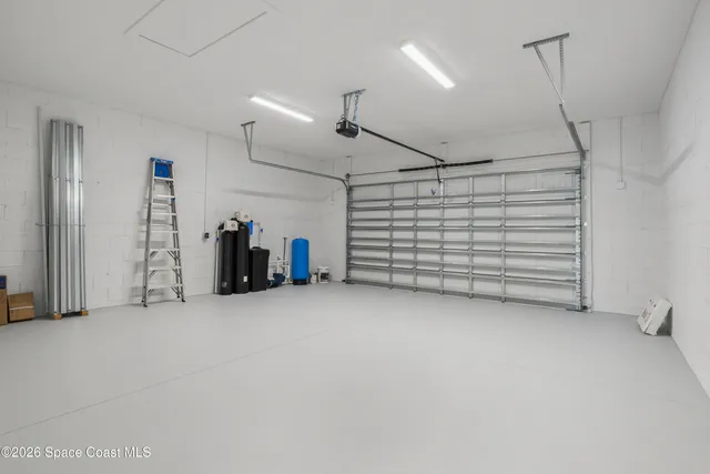 a view of empty room with white walls