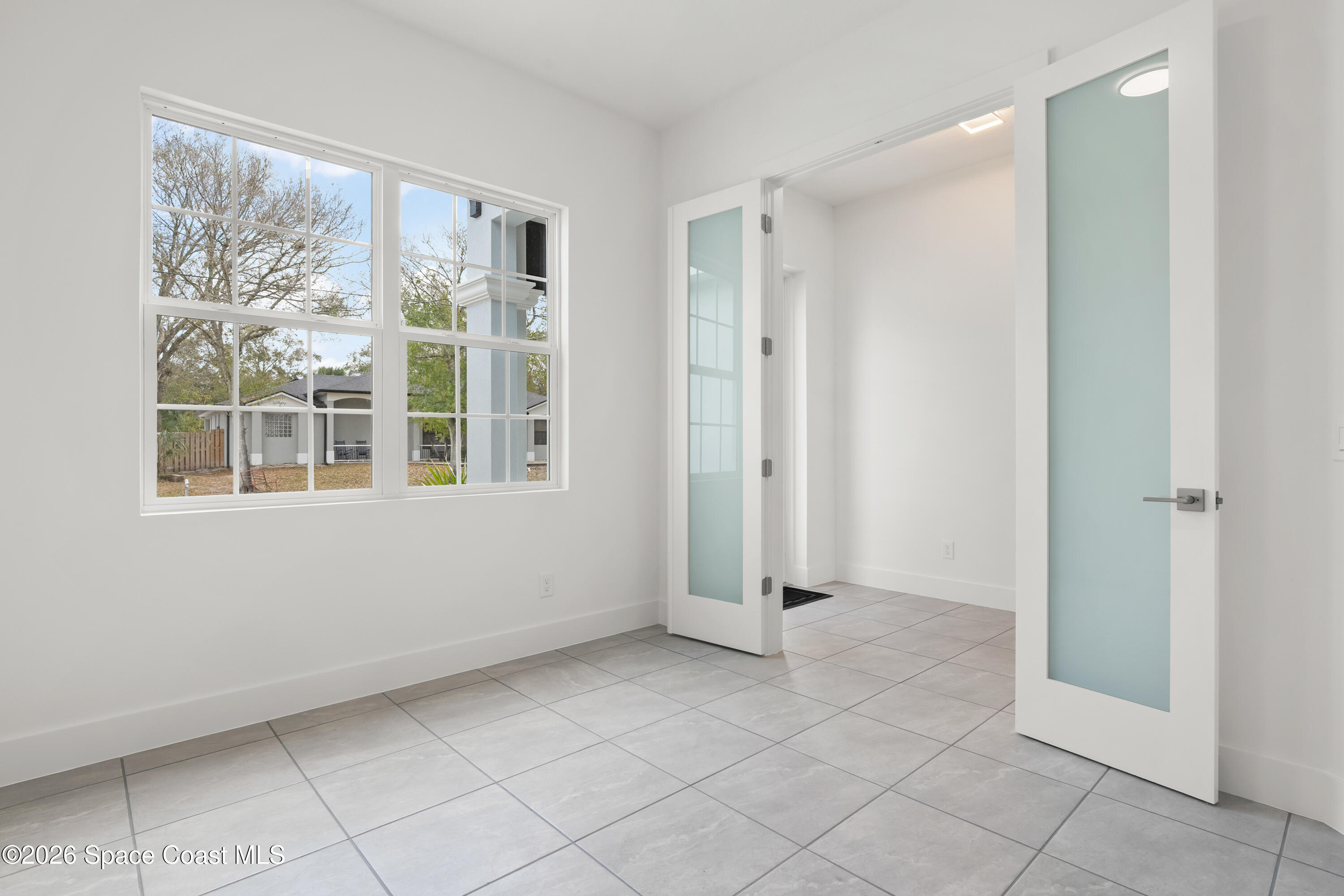 655 Vine Street Melbourne, FL 32904 - Photo 5 of 33 a view of an empty room with window