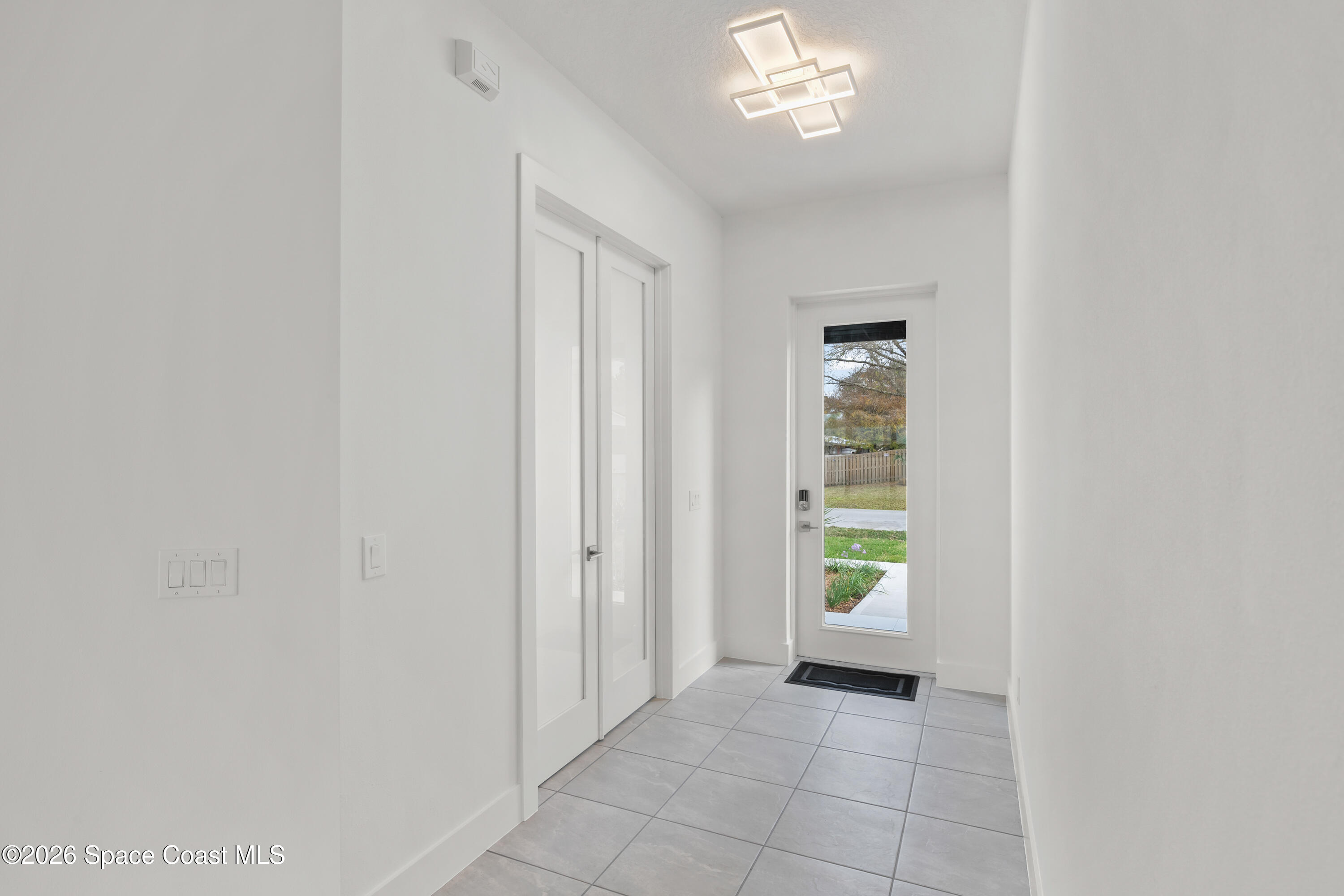 655 Vine Street Melbourne, FL 32904 - Photo 6 of 33 an empty room with windows and closet