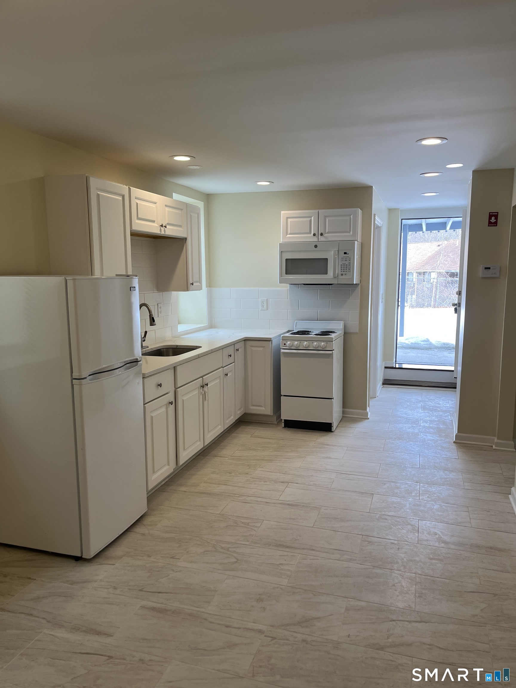 49 New Street Seymour, CT 06483 - Photo 2 of 6 a kitchen with white cabinets and stainless steel appliances