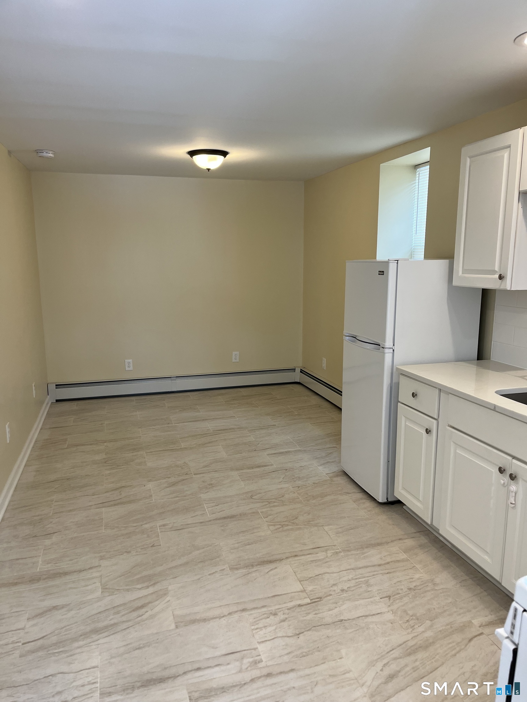 49 New Street Seymour, CT 06483 - Photo 3 of 6 a view of a kitchen with a sink