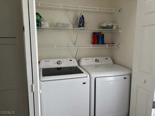 a utility room with dryer and washer