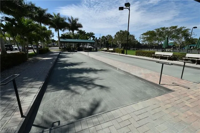a swimming pool with outdoor seating and yard