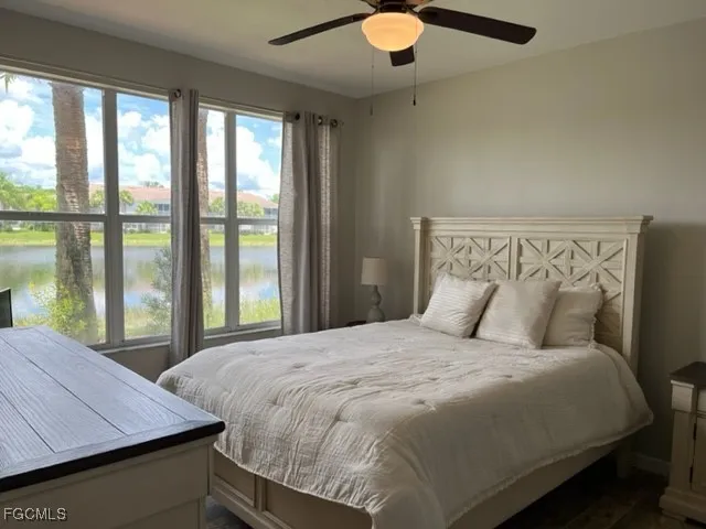 a bedroom with a bed and window