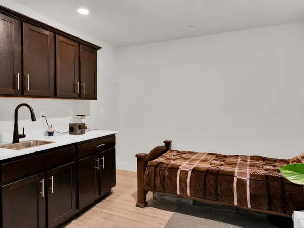 a bedroom with a bed and cabinets