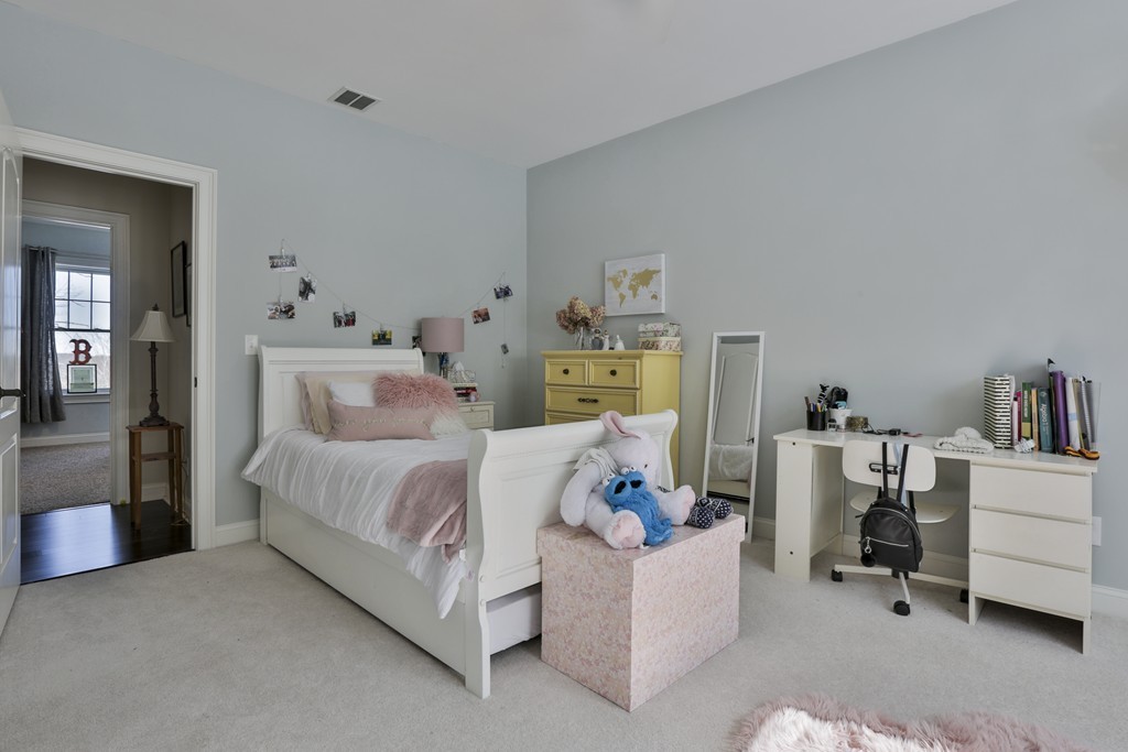 73 Whitney Road Harvard, MA 01451 - Photo 24 of 30 a bedroom with a bed and a couch