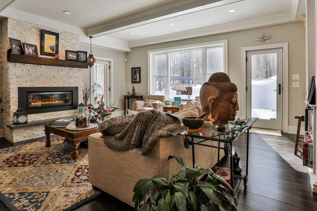 73 Whitney Road Harvard, MA 01451 - Photo 8 of 30 a living room with furniture and a fireplace