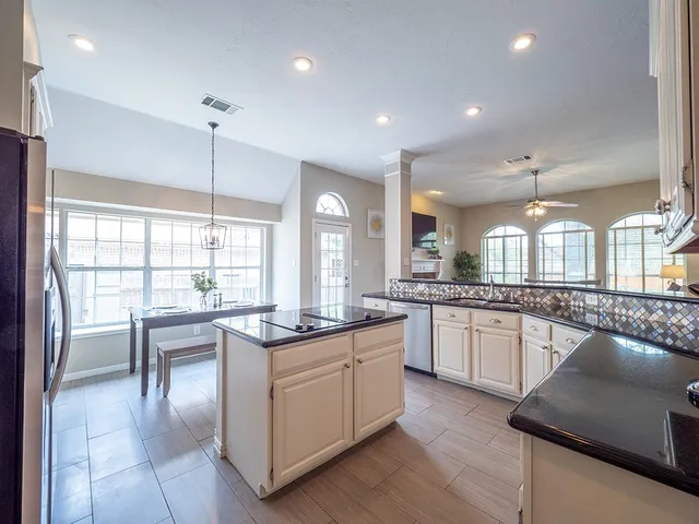 a kitchen with counter top space and appliances