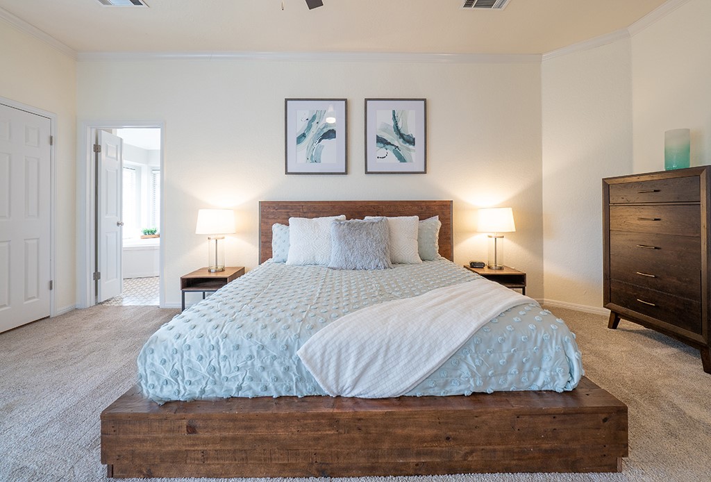 8007 Isaac Pryor Drive Austin, TX 78749 - Photo 17 of 38 a bedroom with a bed and wooden floor