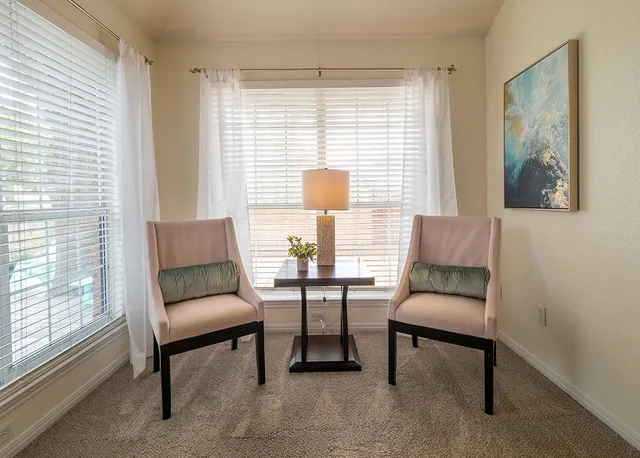 a living room with furniture and a window