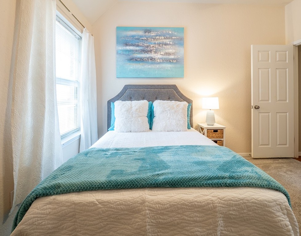 8007 Isaac Pryor Drive Austin, TX 78749 - Photo 23 of 38 a bedroom with a bed and a window