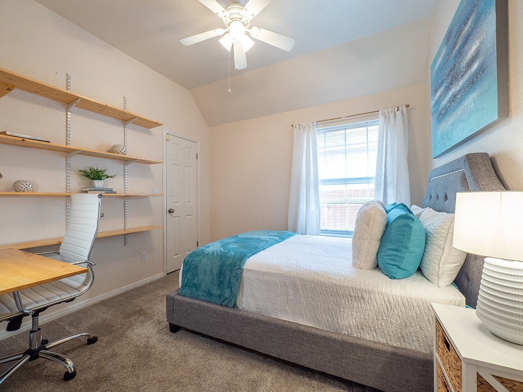 8007 Isaac Pryor Drive Austin, TX 78749 - Photo 24 of 38 a bedroom with a bed and a chandelier