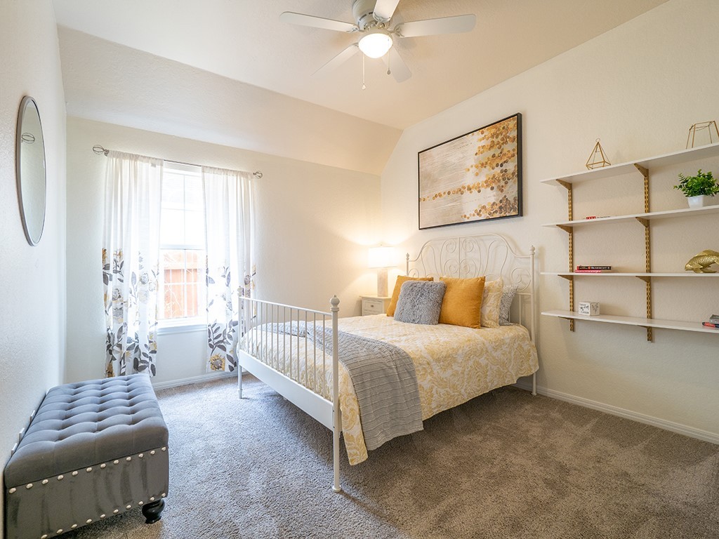 8007 Isaac Pryor Drive Austin, TX 78749 - Photo 31 of 38 a spacious bedroom with a bed and a couch