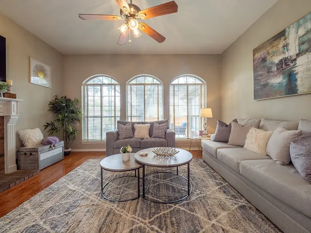 a living room with furniture and a large window