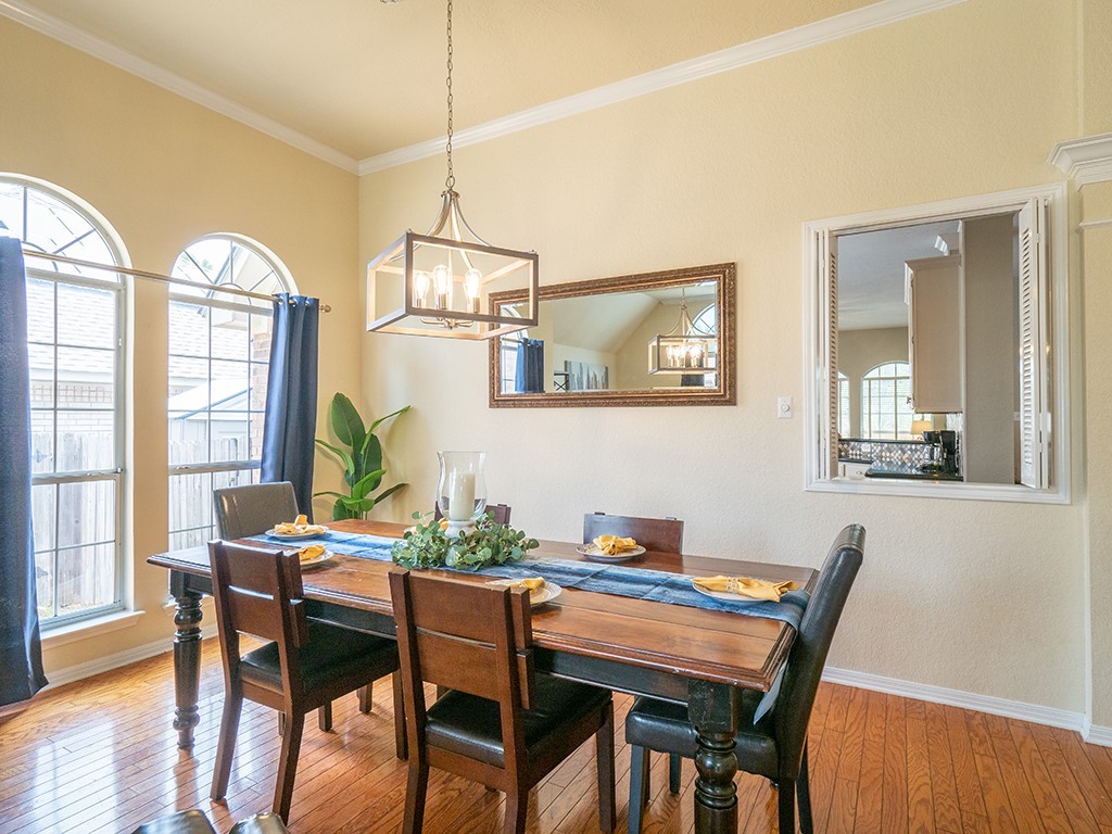 8007 Isaac Pryor Drive Austin, TX 78749 - Photo 9 of 38 a view of a dining room with furniture window and wooden floor