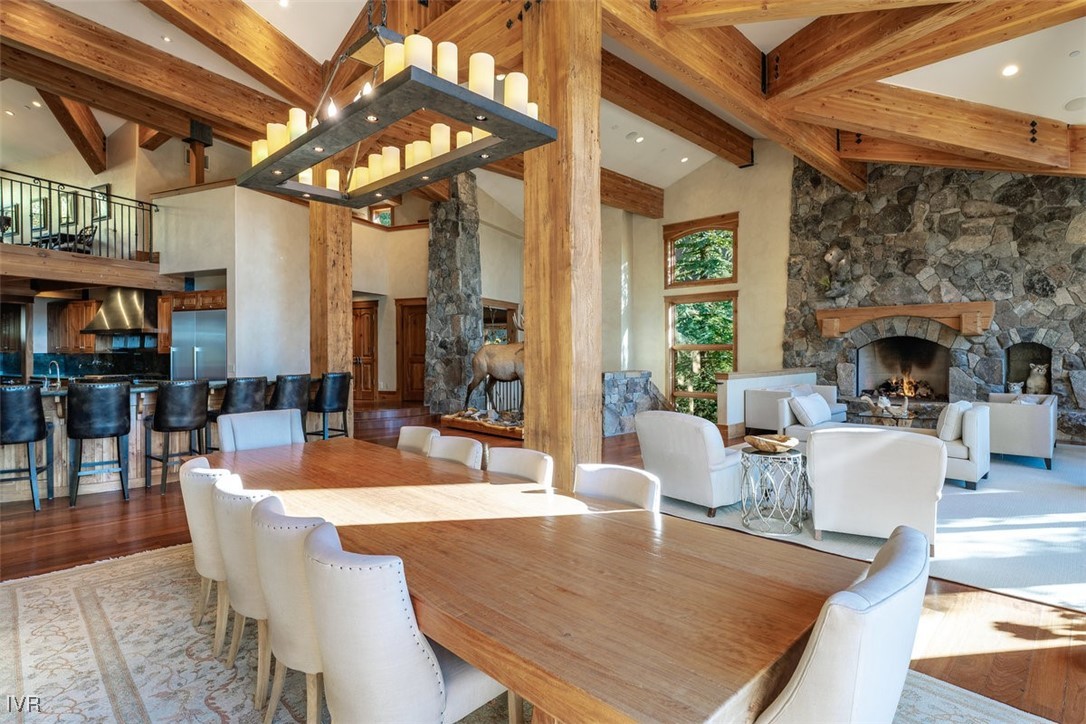 951 Divot Court Incline Village, NV 89451 - Photo 15 of 50 a dining room with wooden floor a chandelier a wooden table and chairs
