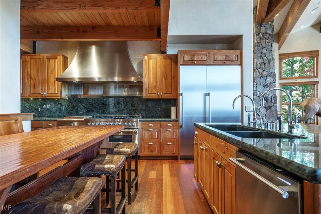 951 Divot Court Incline Village, NV 89451 - Photo 22 of 50 a kitchen with stainless steel appliances granite countertop a sink and a counter