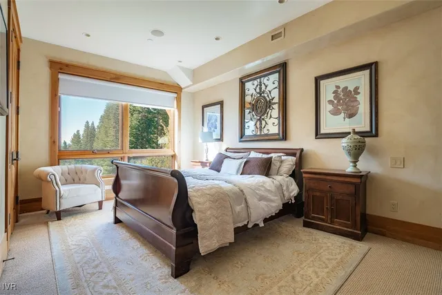 a bedroom with furniture and a fireplace