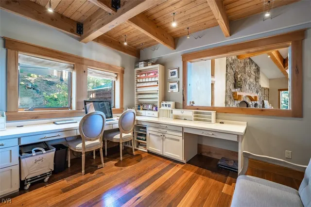 a spacious bathroom with a granite countertop tub sink and mirror