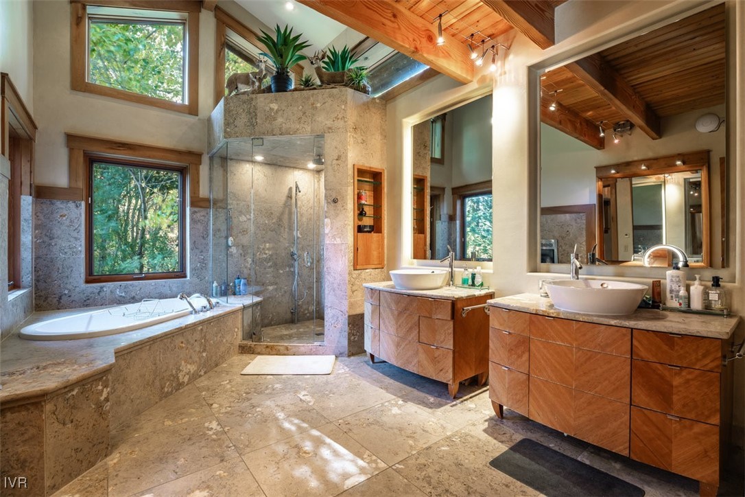 951 Divot Court Incline Village, NV 89451 - Photo 45 of 50 a spacious bathroom with a granite countertop tub sink and mirror