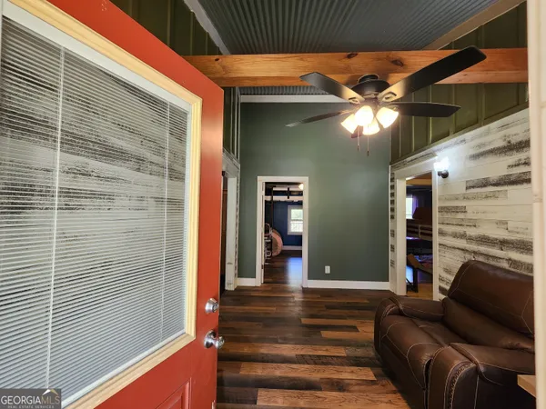 a view of a livingroom with furniture and entryway