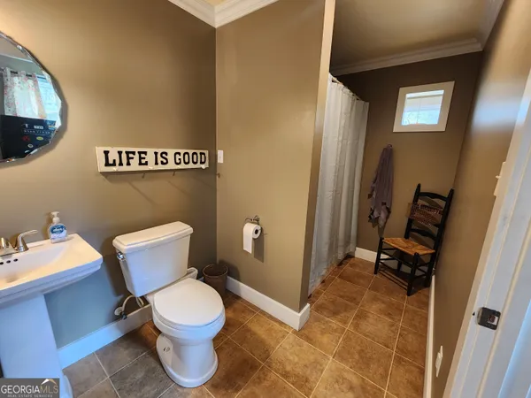 a bathroom with a toilet and a sink