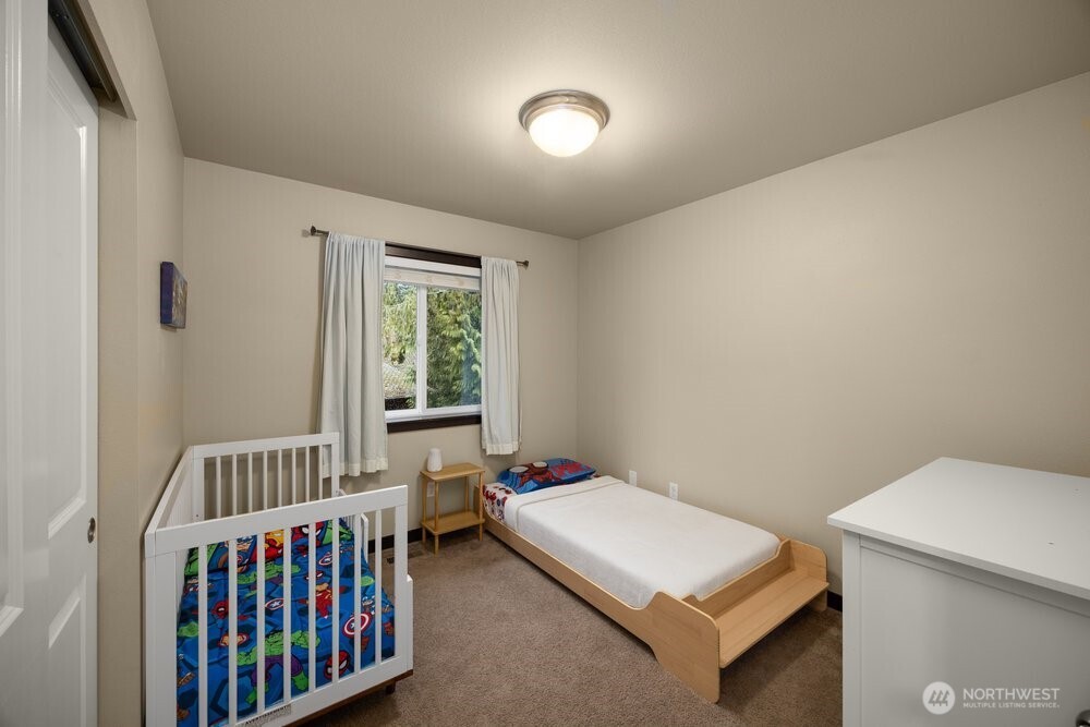 424 Barry Loop Mount Vernon, WA 98274 - Photo 17 of 23 a bedroom with a bed and a window