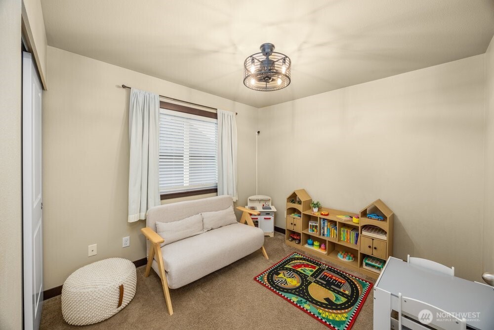 424 Barry Loop Mount Vernon, WA 98274 - Photo 19 of 23 a living room with furniture and a window