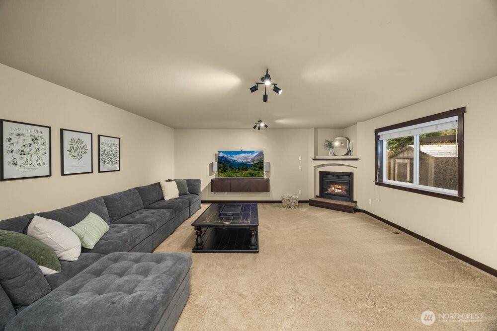 424 Barry Loop Mount Vernon, WA 98274 - Photo 5 of 23 a living room with furniture and a fireplace