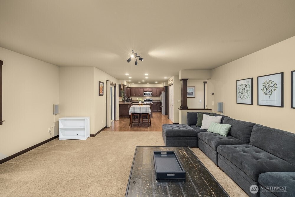 424 Barry Loop Mount Vernon, WA 98274 - Photo 6 of 23 a living room with furniture and a chandelier